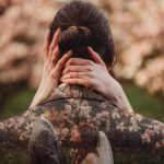 Romantic couple embracing with floral background.