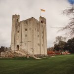 Historic English castle with flying flag