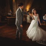 Bride and groom dancing at wedding reception.