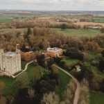 Aerial view of English countryside castle and estate.