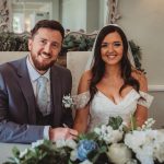 Bride and groom smiling on wedding day