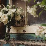 White rose bouquet on rustic windowsill