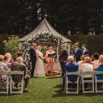 Outdoor wedding ceremony with guests seated