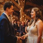 Bride and groom exchanging vows at wedding ceremony.