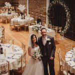 Bride and groom in decorated wedding venue