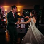 Couple dancing at a wedding with live band