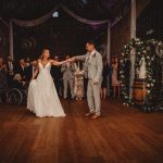 Bride and groom enjoy their first dance.