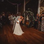 Bride and groom share first wedding dance.