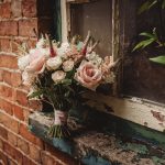 Bouquet of flowers on rustic windowsill