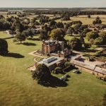 Aerial view of historic country house and gardens