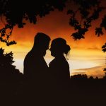 Silhouette couple sunset romantic scene