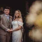 Bride and groom smiling at their wedding