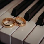 Two gold rings on piano keys