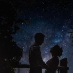 Silhouetted couple under a starlit night sky.