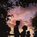 Couple silhouette at sunset with vibrant sky