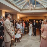 Bride walking down the aisle with father.