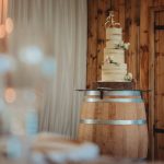 Wedding cake on wooden barrel display