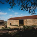 Historic stone barn in countryside setting