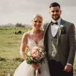 Bride and groom in countryside setting