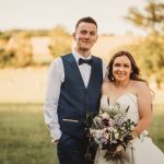 Happy couple in countryside wedding portrait