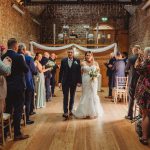 Bride and groom walking down the aisle