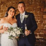 Bride and groom holding drinks and flowers